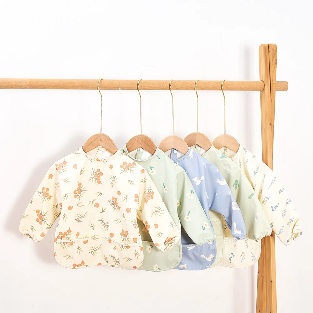New Product long sleeve bib baby feeding PU material quick clean baby rice pocket anti-dirty baby bib wholesale