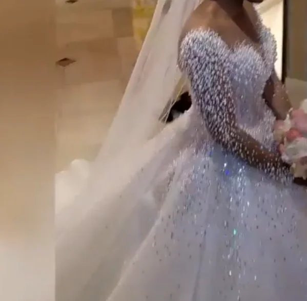 Luxury pearls ball gown wedding dress long sleeve v neck heavy pearl beaded wedding gown bridal dress