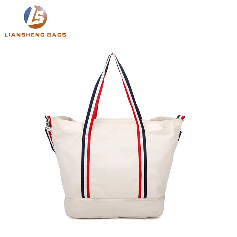 
Large canvas bag with separate layer of shoes and umbrellas underneath 