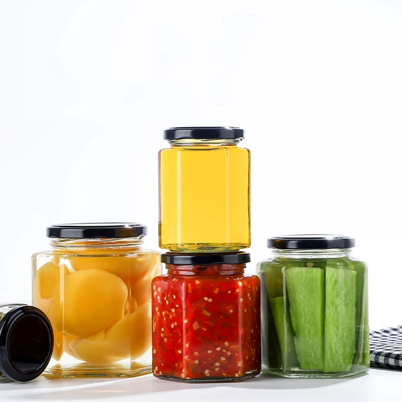 Wholesale point 250ml 500ml food storage bottle with lid, honey glass bottle, hexagonal golden spiral cap glass sealed jar