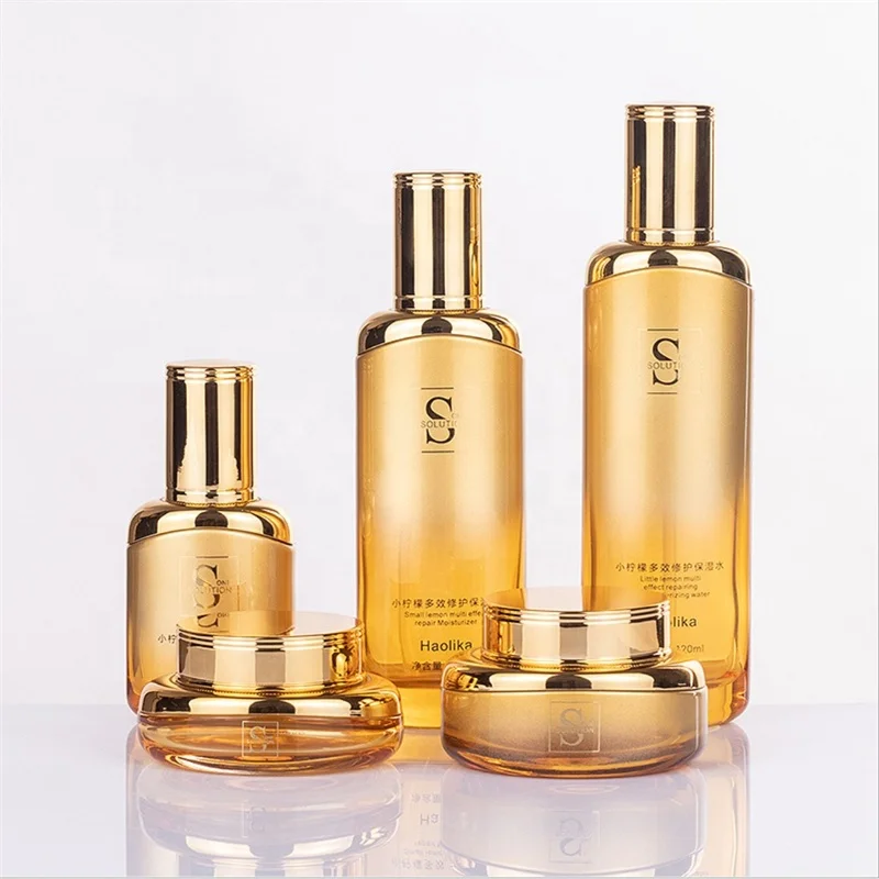 Luxury BaoMo China Glass Factory skin care packaging gold cosmetic glass cream jars and pump bottles