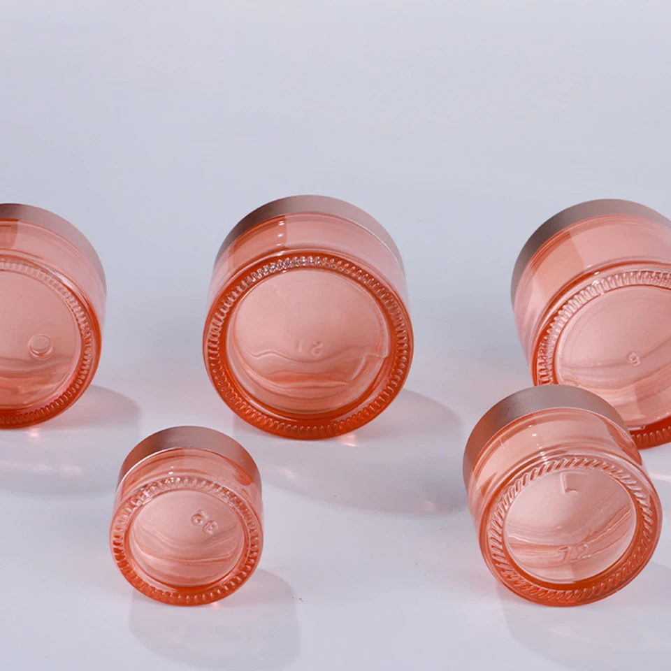 New product 5g 10g 15g 30g 50g 100g  clear pink glass cream jar with gold black sliver aluminium Cap Luxury skincare packaging