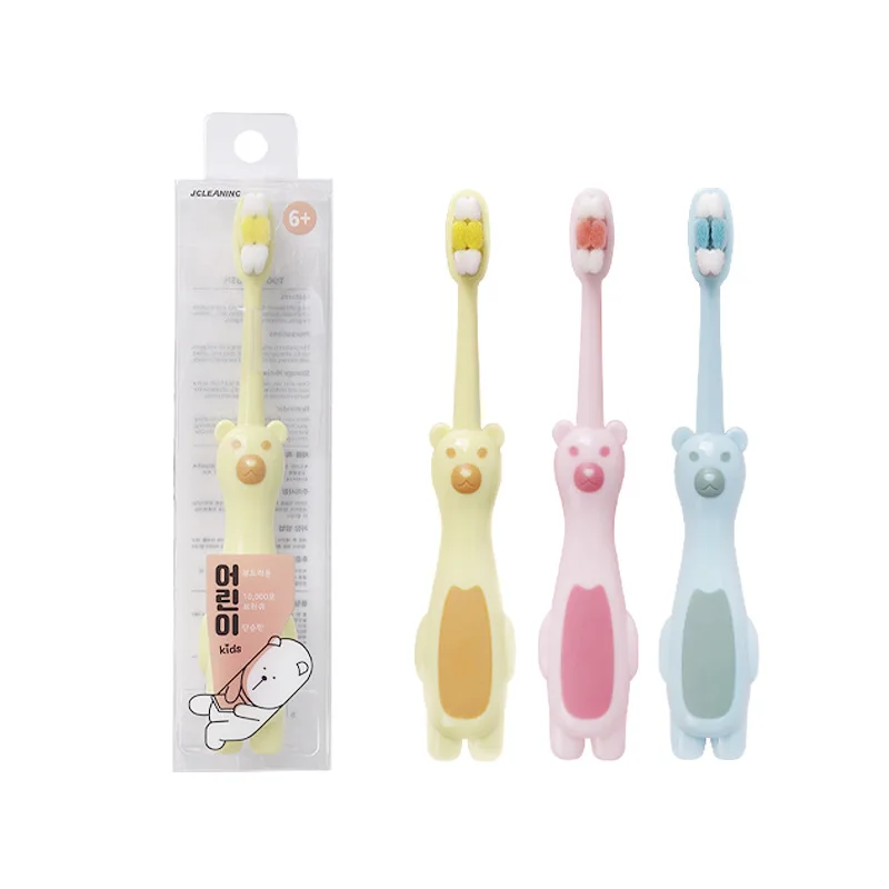 Wholesale OEM child kids silicone BPA free white bear cartoon 10000 PBT soft bristles portable travel manual toothbrush
