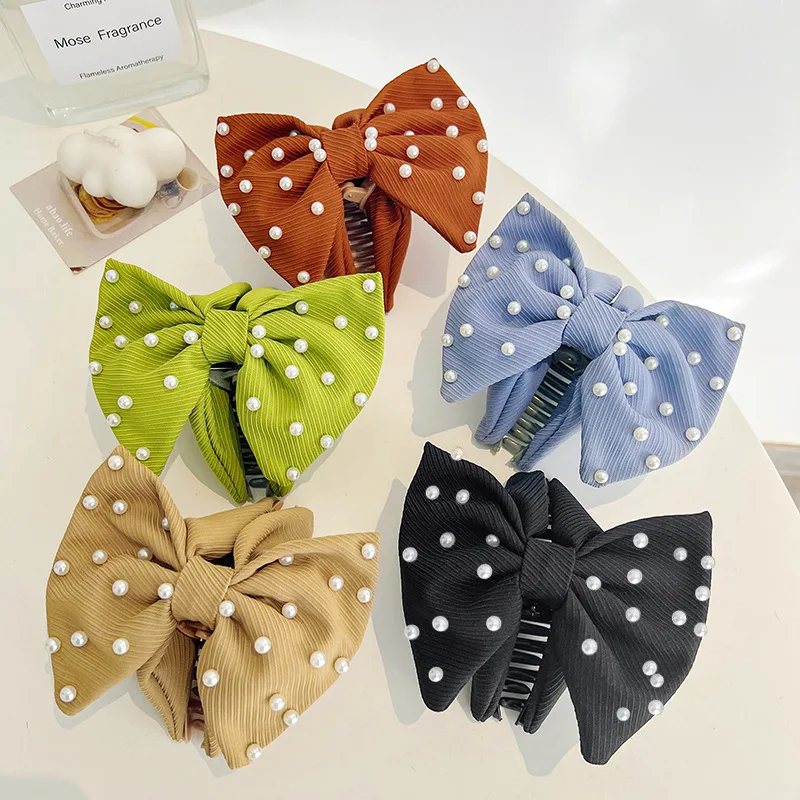 Korean version of the new solid color small fresh pearl bow grip large back head shark top hair clip