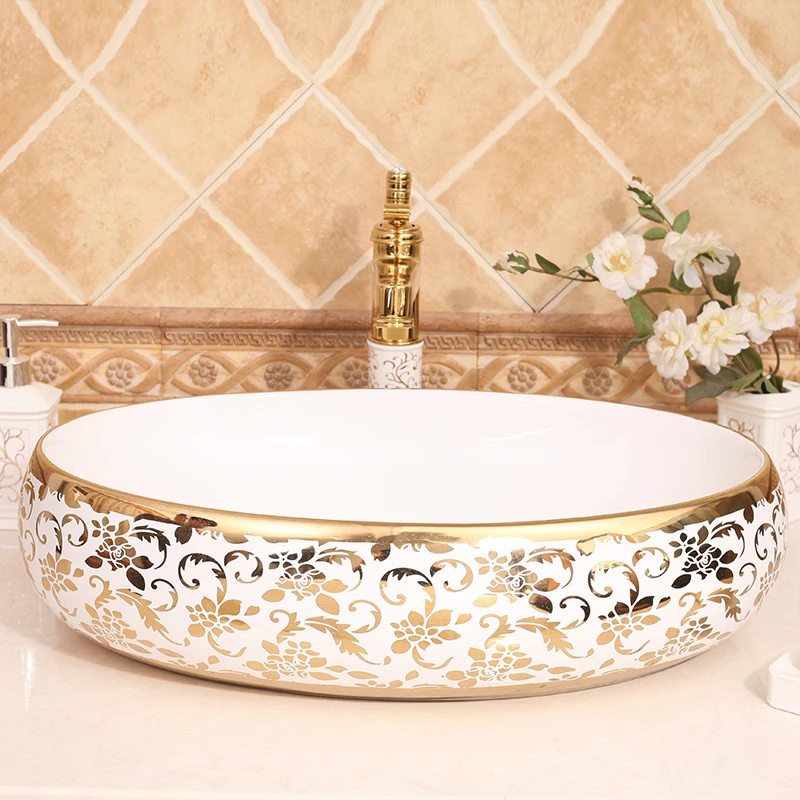 Gilded Elegance Oval Shaped Basin with Intricate Gold Designs for a Luxurious Bathroom ceramic art wash basin counter top sinks