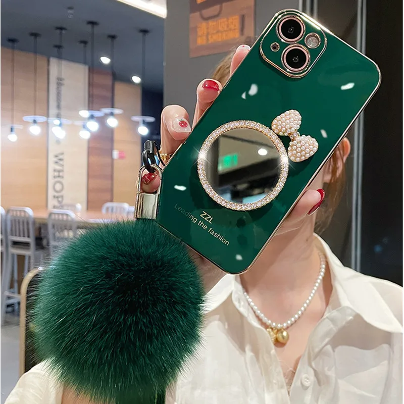 Fashion Luxury Bow Rhinestones Mirror Back Cover Plating TPU Fur Ball hand strap Girls Phone Case for iPhone 13 12 Pro Max