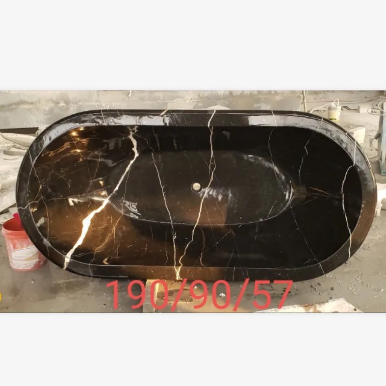 freestanding honed Nero Margiua oval marble stone bathtub