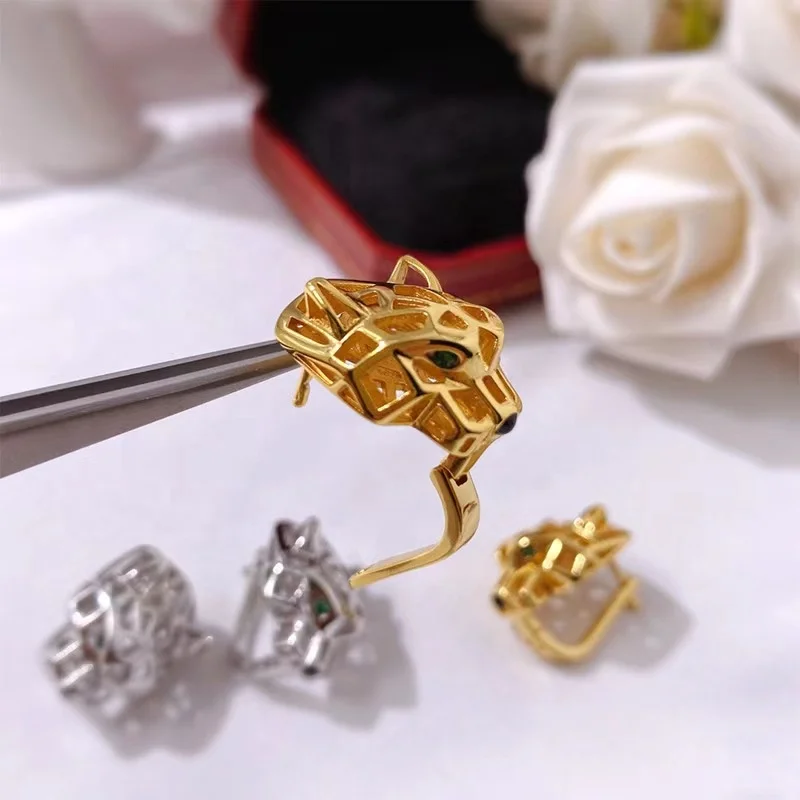 High quality European and American fashion personality charm ear clip cool hollow green eyed tiger head ring for men and women