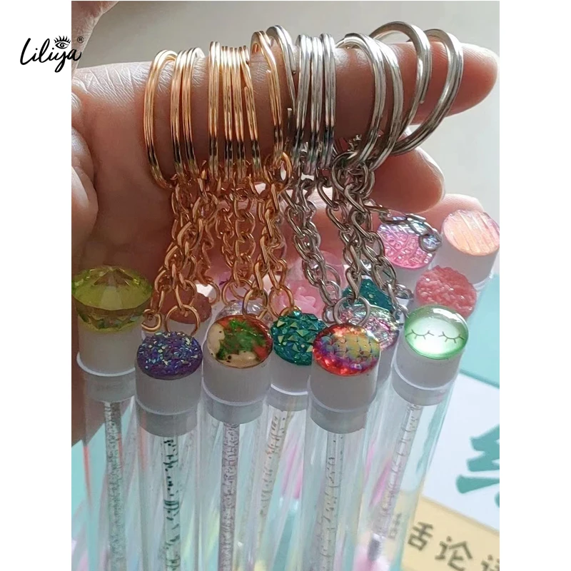 Wholesale OEM lash spoolie unique eyelash brush empty mascara tubes with brush keychain