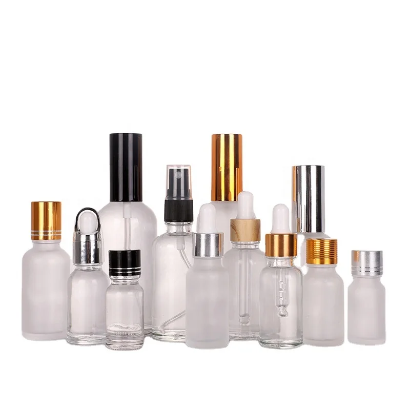Glass bottle with golden silver sprayer pump or lotion pump skin care products and perfume glass bottle