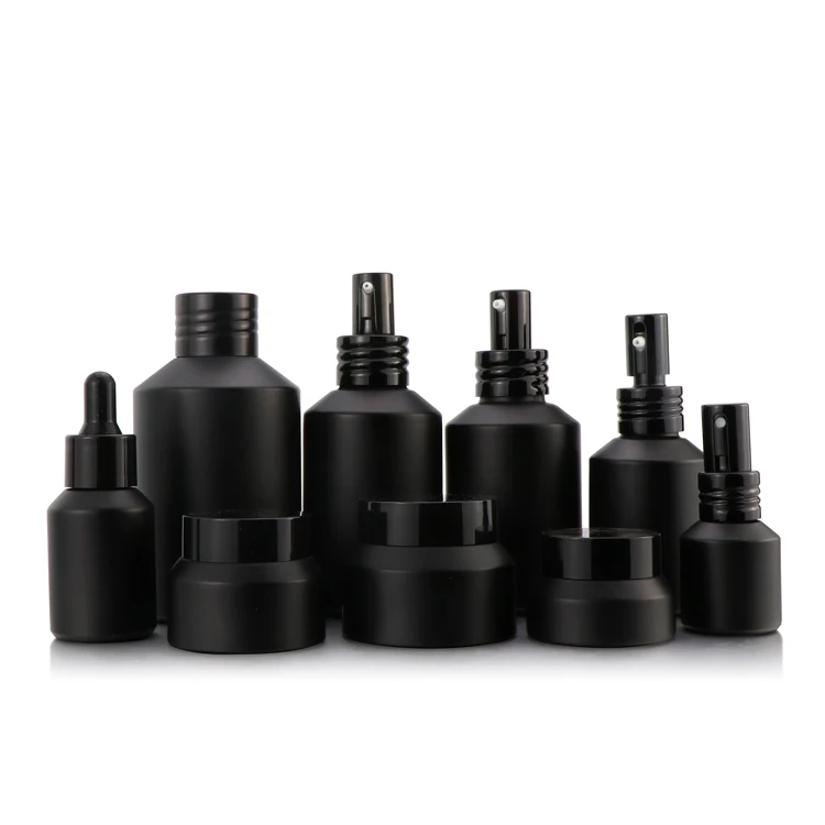 Wholesale 15 30 50 125 200 g empty cylinder shape makeup cream matte black glass cream jar for cosmetic cream with screw top cap