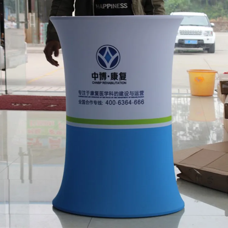 Low MOQ Exhibition Booth Portable Tension Fabric Advertising Display Auto Shrink Pop Up Display Counter Table