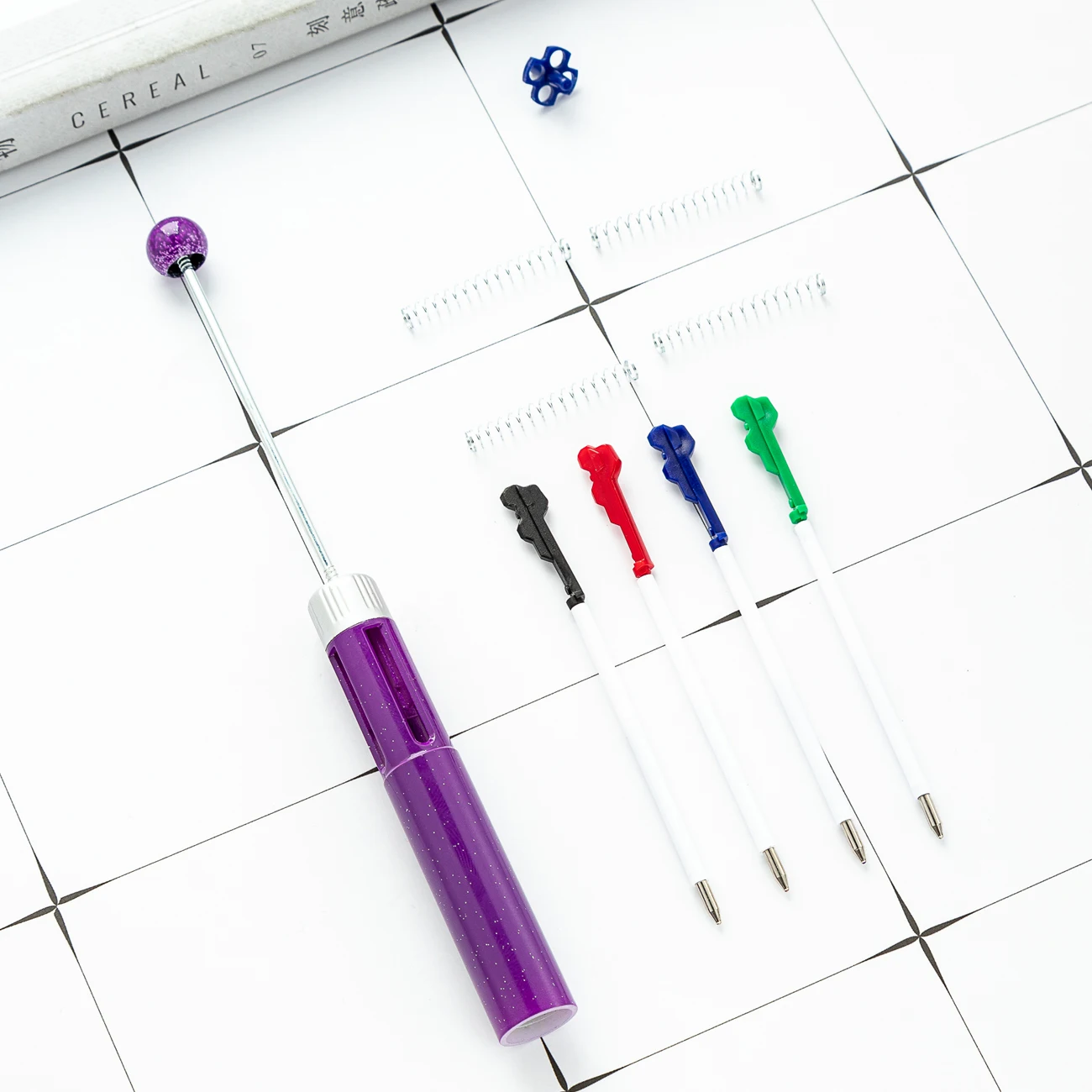 New DIY four-color bead pen wholesale creative multi-color plastic ballpoint pen student four in one press hands-on account pen