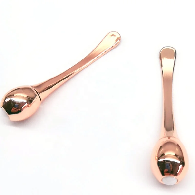 Luxury golden metal spatula in cosmetic along with skincare cream jars