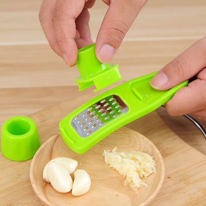 Explosive hot selling kitchen household garlic grinder creative multifunctional ginger grinder and garlic cutter wholesale