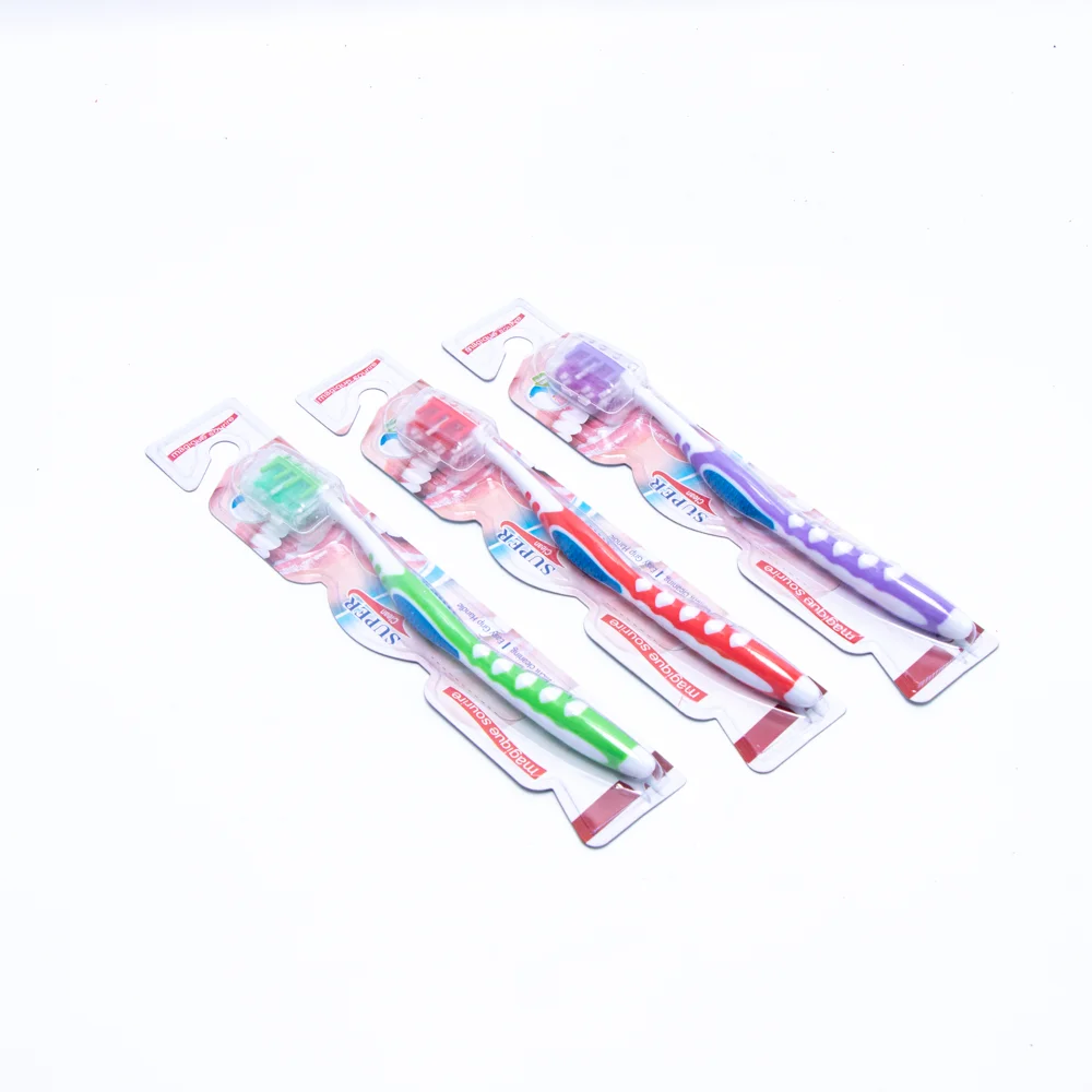 Made in China adult toothbrush with pp colorful handle gum massage feature silicone adult toothbrush