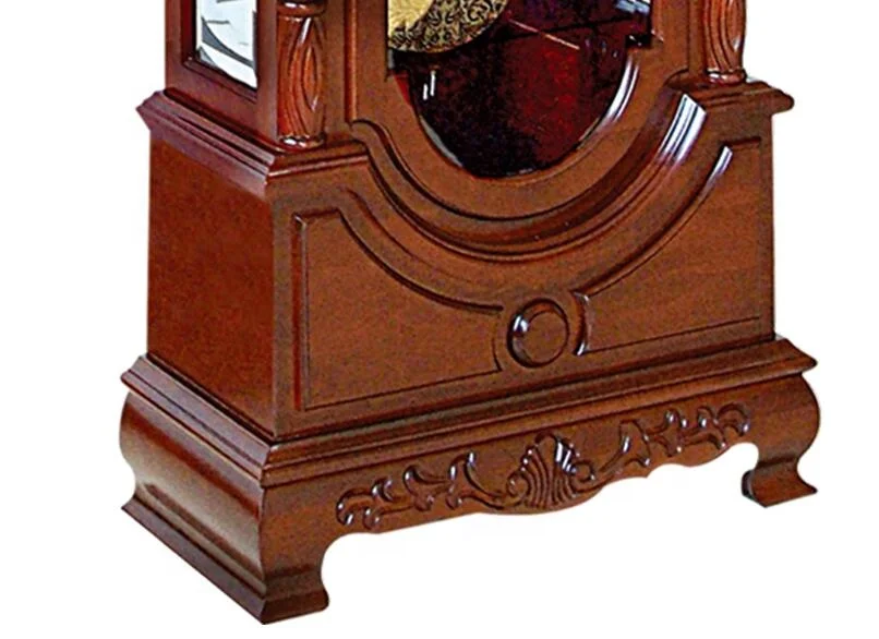 Floor Grandfather Clock the elaborate dial includes raised brass Arabic numerals, cast center and corner ornaments moon phase