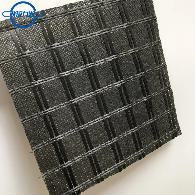 Fiberglass geogrid composite with nonwoven fabric/geotextile to reduce reflective cracking