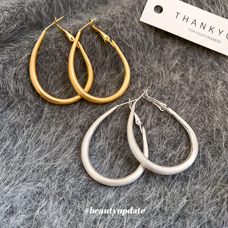 Gold electroplated silver needle oval metal hoop earrings for women cold wind personality fashion everything with