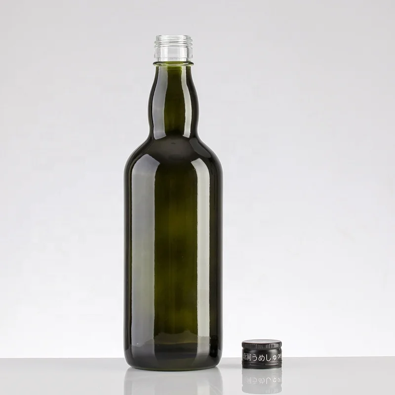 Old-fashioned green glass bottles for spirits, whiskey, rum and liqueur antique green color champagne glass bottle