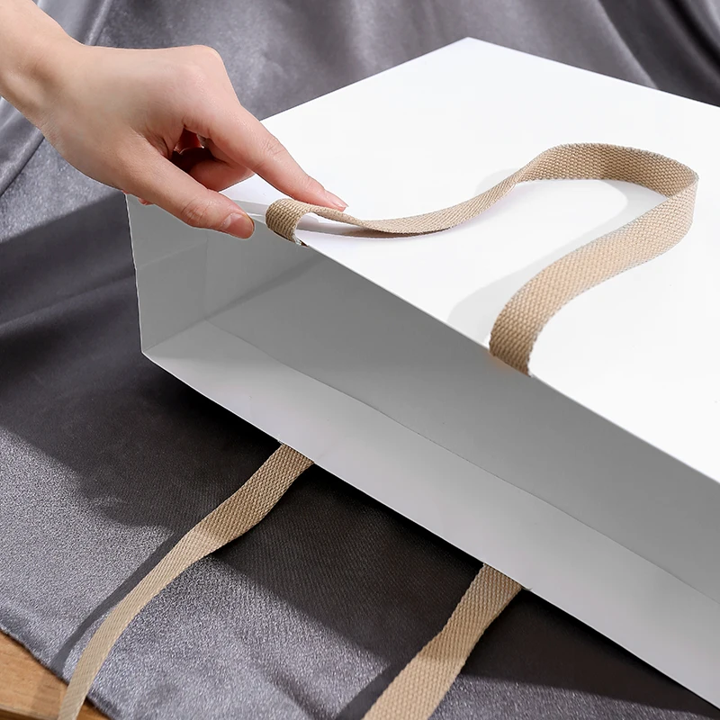 Hot-selling Custom Logo Printed Recyclable Shopping Clothing Store Colorful Paper Bags With Handle And Ribbon For Shoes