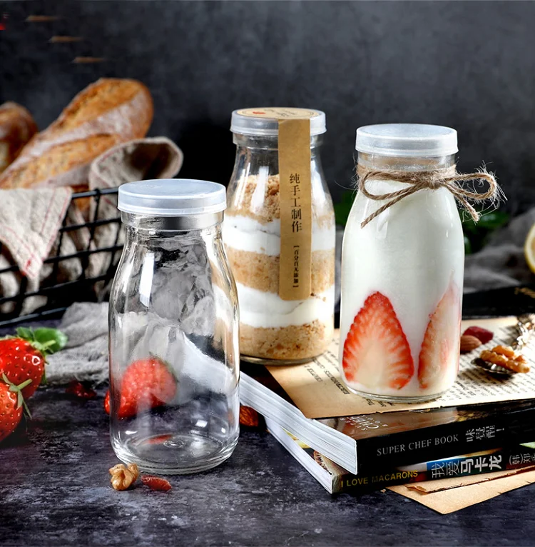 Wholesale price custom logo transparent glass milk bottles of various sizes 200ml 250ml 500ml 1000ml 6oz 8oz 16oz 32oz