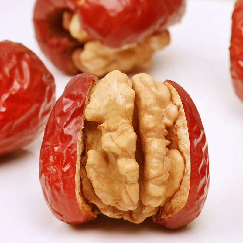 Handmade walnut kernels and red dates for producing nut snacks