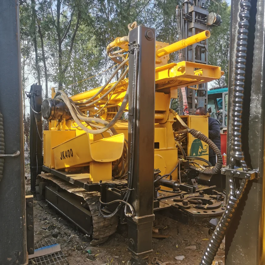Second hand used Jinke JK400 crawler hydraulic 400 m depth 6.6m high tower water well drilling rig drilling machine
