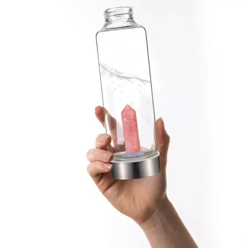 Glass Water Bottle With Rose Quartz Crystal on the Bottom