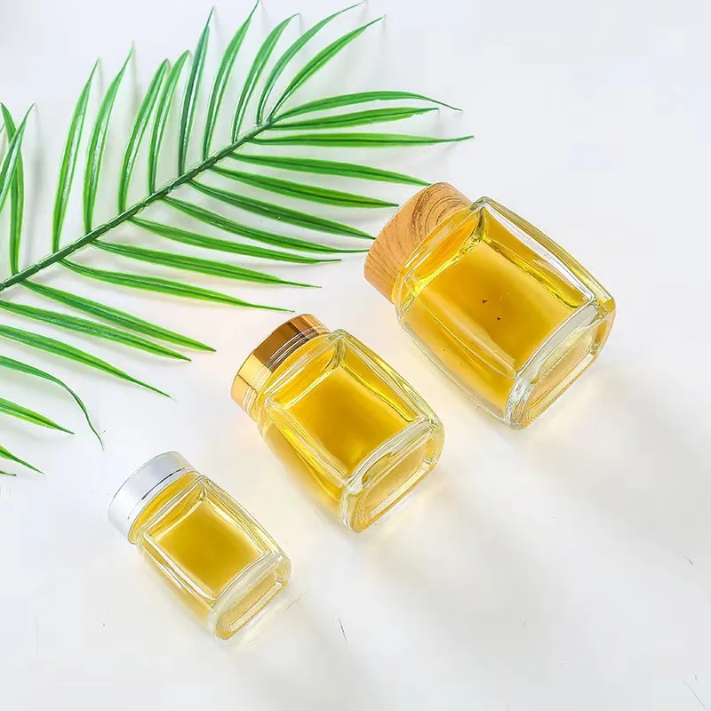 Wholesale square glass honey jar with screw metal lid glass bottle container
