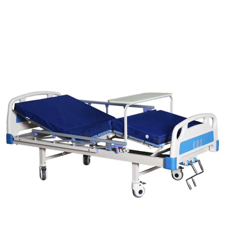 High quality 2 Cranks Manual Hospital Bed With ABS turn-over table