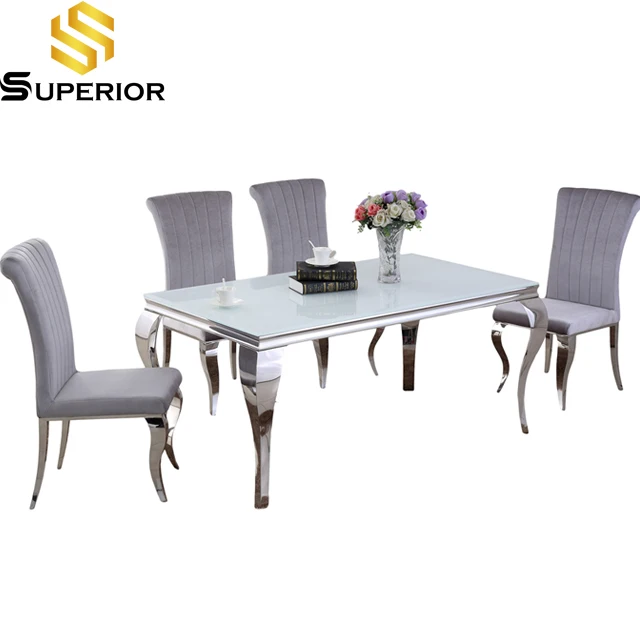 round serpentine feet metal frame dining table modern style