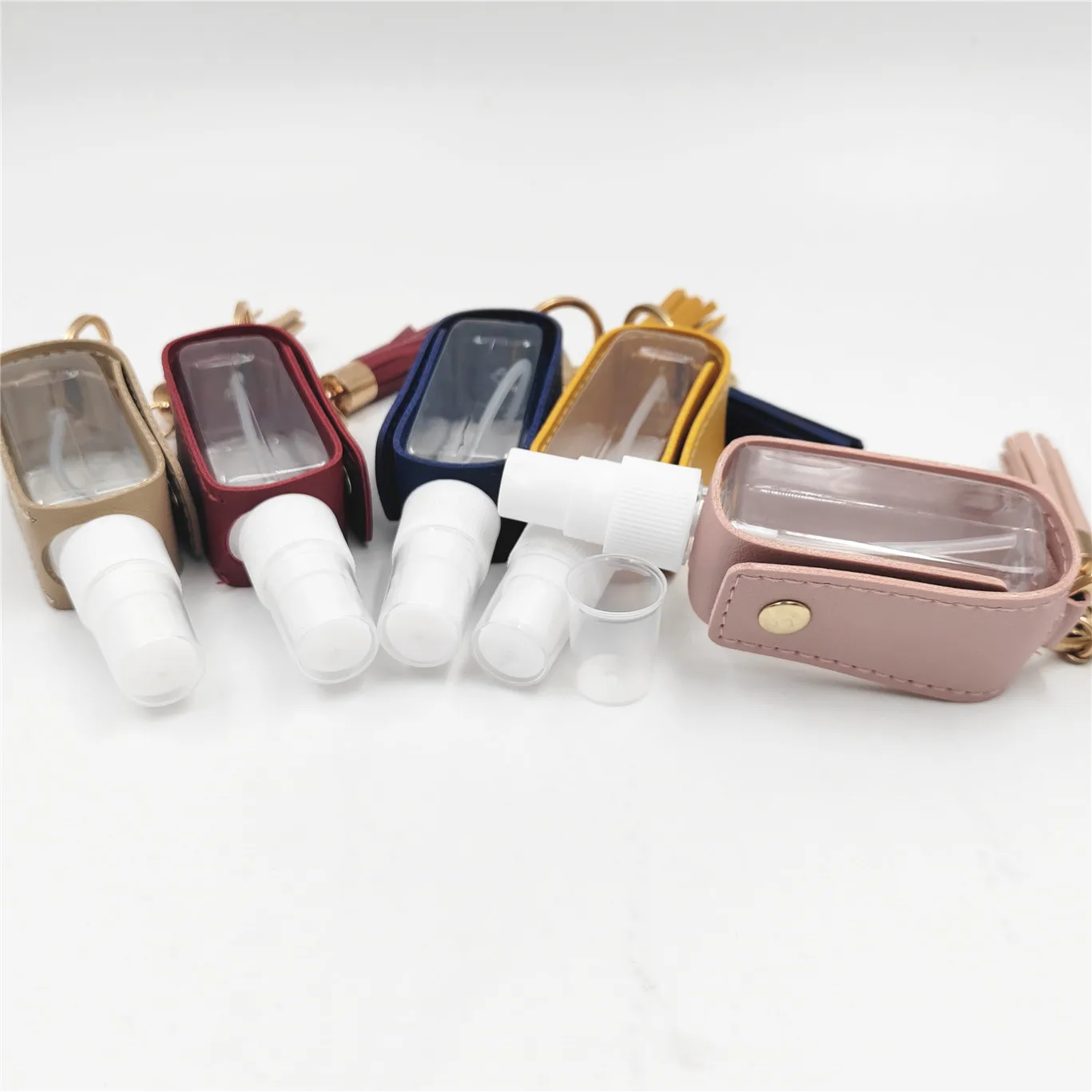Pocket 30ml Mini Plastic Spray Hand Sanitizer Alcohol Pet Bottle with PU Leather Keychain Holder Plastic Bottle Manufacturer