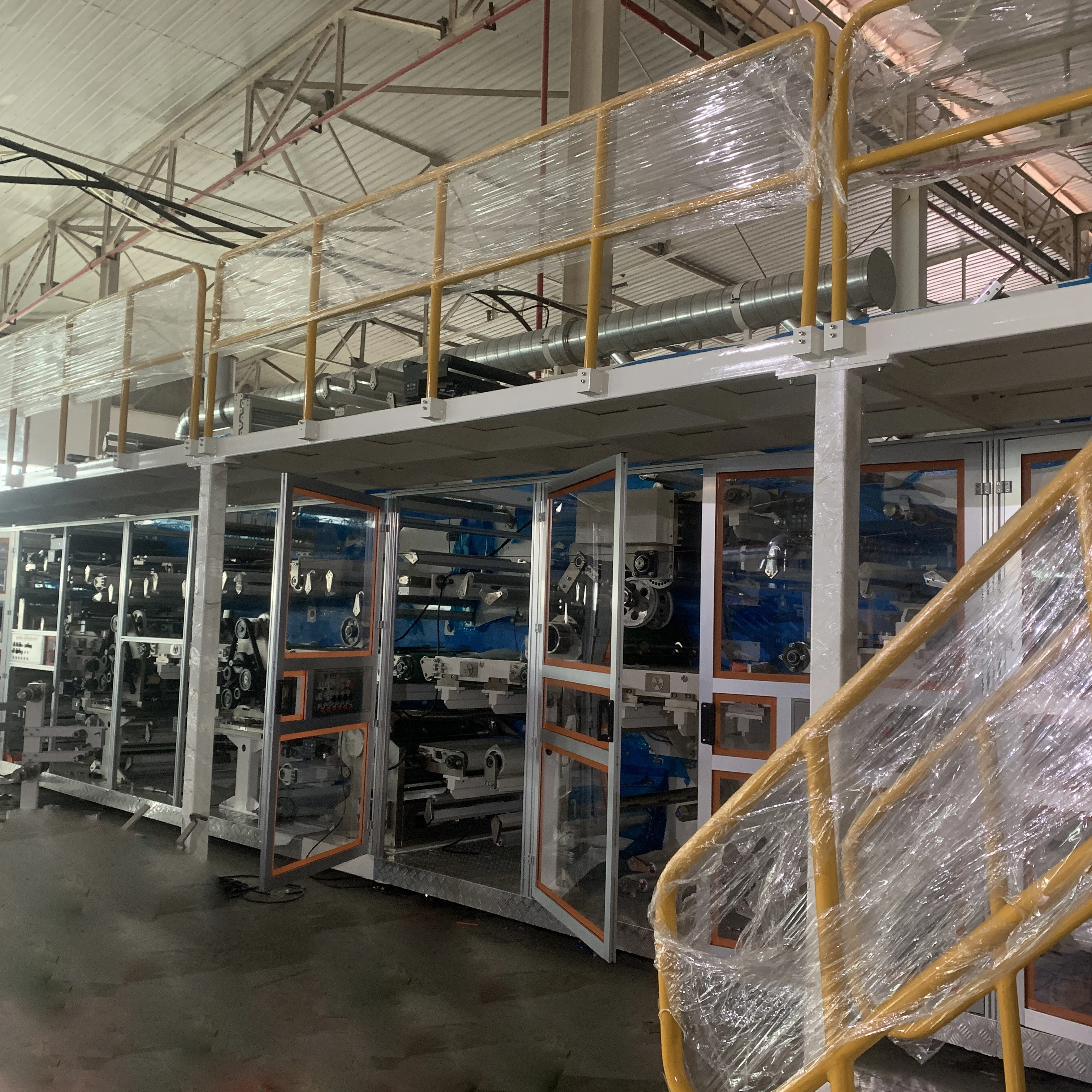 Hot Sell Low Price Full Automatic Servo Motor Driving Disposable Fluff Pulp Adult Patient Diapers Production Line