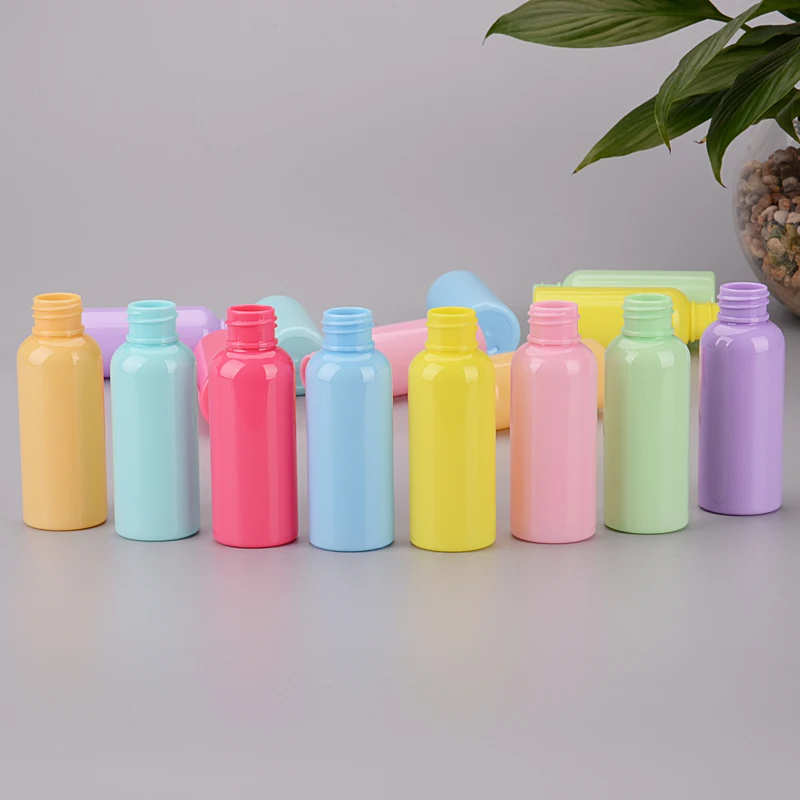 2oz 50ml Wholesale Colorful Empty Plastic Spray Bottle Cosmetic Skin Care Mini PET Bottle with Spray Pump Customized Labeling