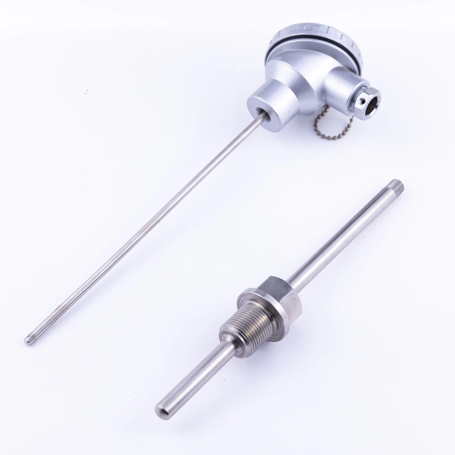 Mineral insulated RTD sensor with thermowell  Thermocouple consists of two wires, each made of different metal, welded together
