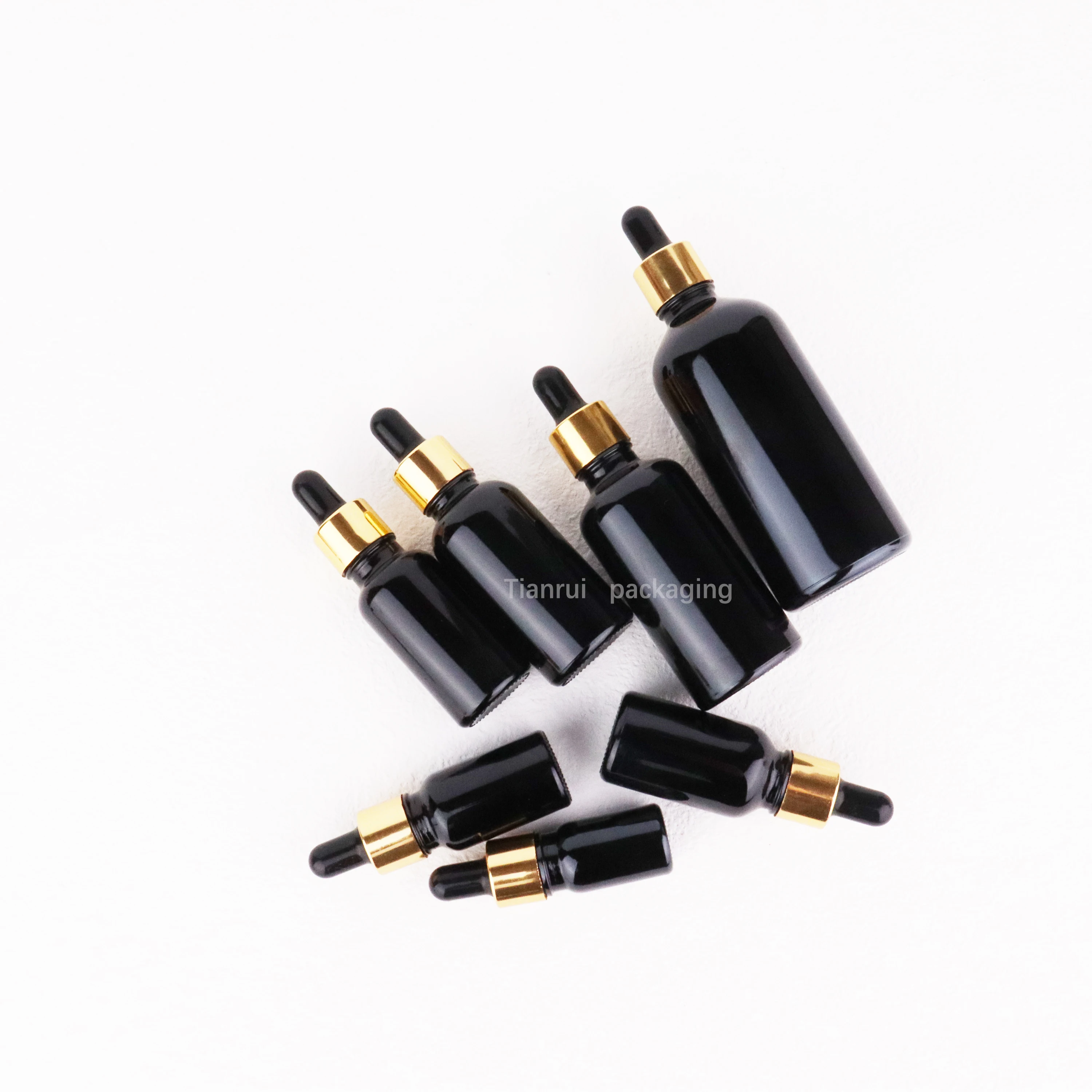 Custom 5ml 10ml 15 ml 20ml 30ml 50ml 100 ml UV Proof Black Essential Oil Glass Dropper Bottle with Sliver Lid in Bulk