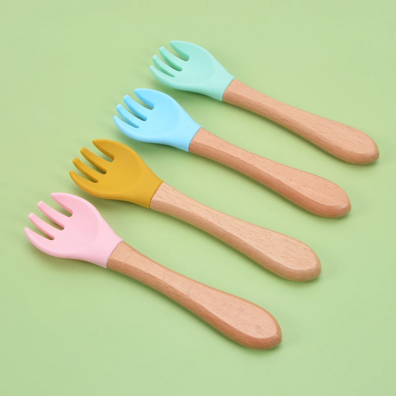 Top Selling Baby Soft Silicone Feeding Forks Nature Materials Infant Silicone Tips Baby Fork With Wooden Handle