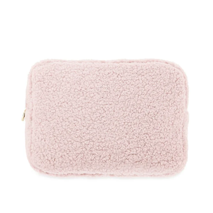 faux shearling pouch featuring a rectangle-shaped body and a zippered top handle