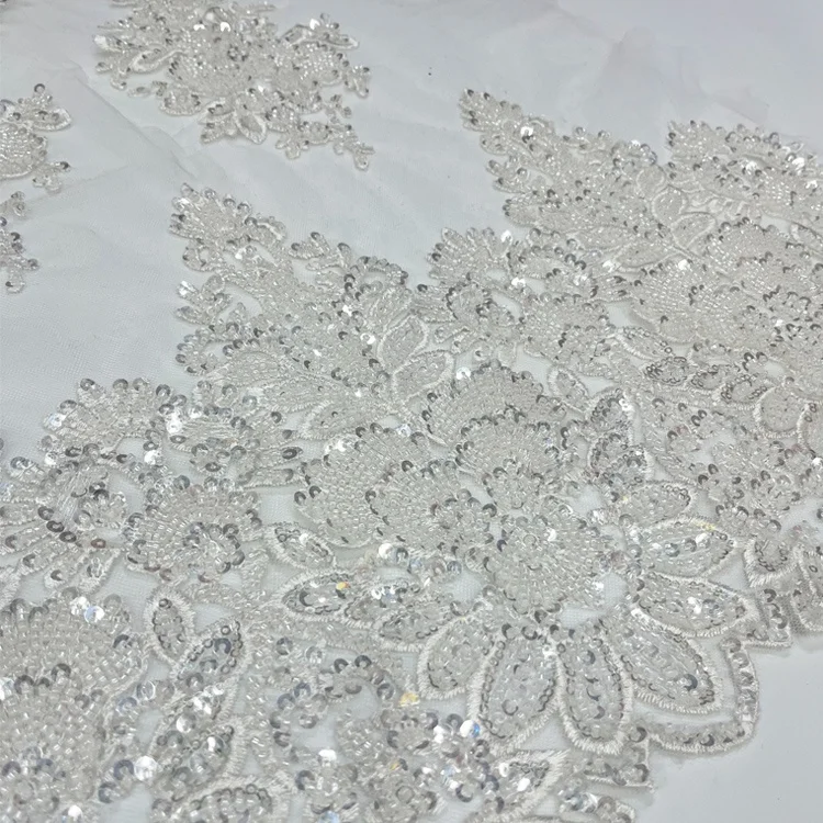 factory wholesale unique  bridal lace fabric beaded luxury heavy beaded border lace fabric for wedding