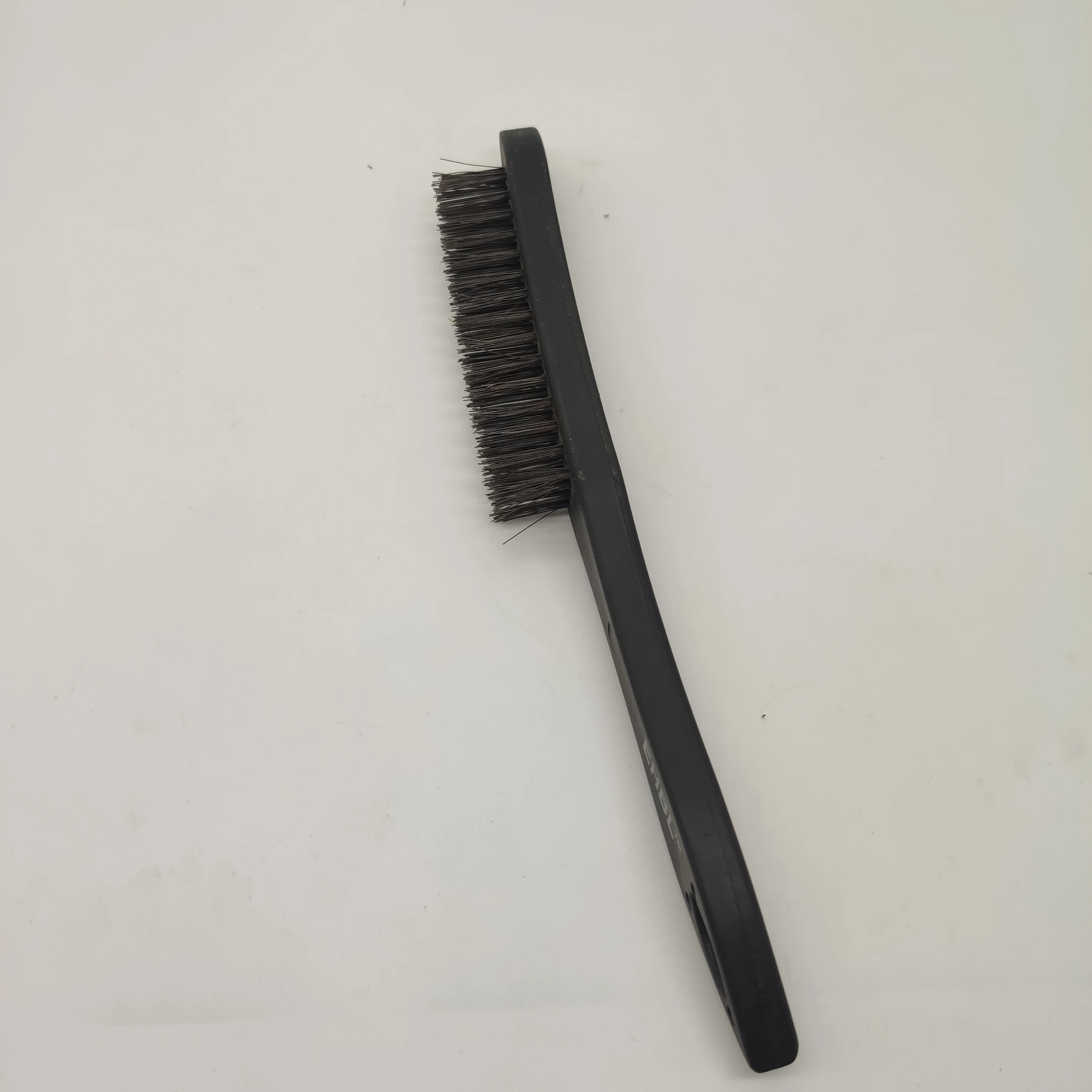Carbon steel wire brush with black plastic handle for cleaning