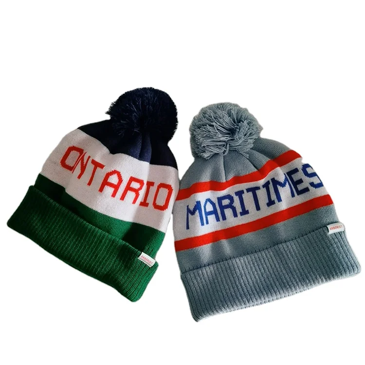 Hot Sale Acrylic Cuff Jacquard Knitted Winter Hat Beanie Hat Embroidered Pom Pom Ball Beanie Cap With Custom Leather Badge Logo