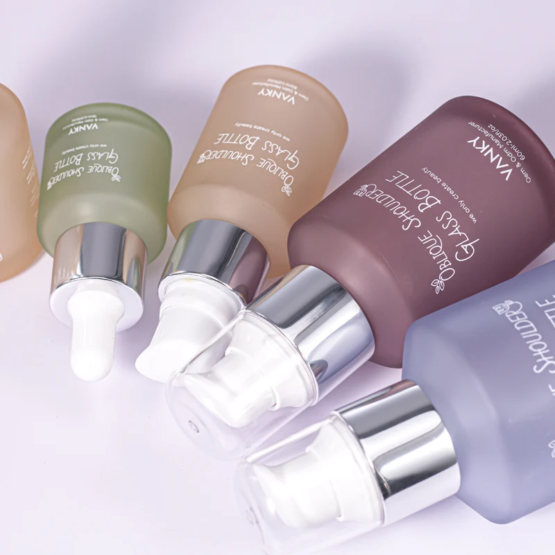 New Design Luxury 30ml 60ml 100ml Oblique Shoulder Bottle Customized Green Serum Essential Oil Dropper Glass Bottle With Pump