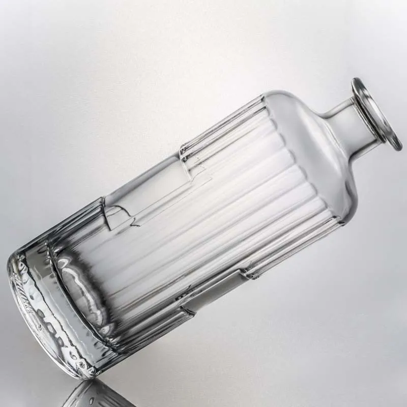 Customizable capacity embossed round shape spirit glass bottle with cork for whisky vodka tequila gin rum