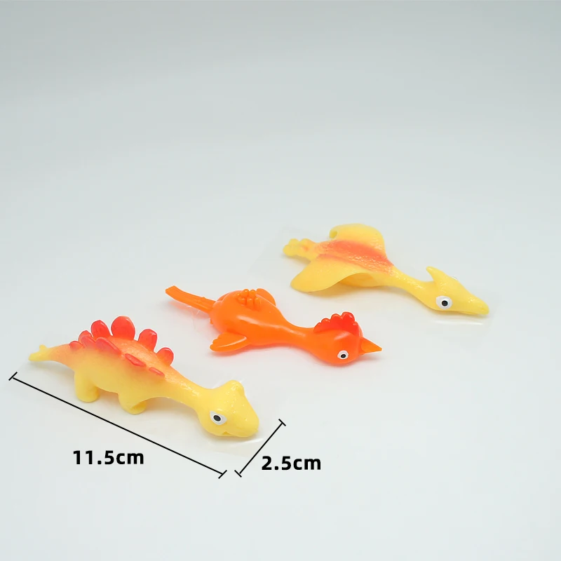 Hot Sale TPR Material High Quality Promotion TPR Dinosaur Toy Slingshot Catapult Toys Small Children Toys
