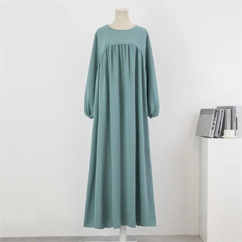 Muslim loose plus size long sleeved solid color pullover robe dress spring and autumn knee length long skirt dress OEM
