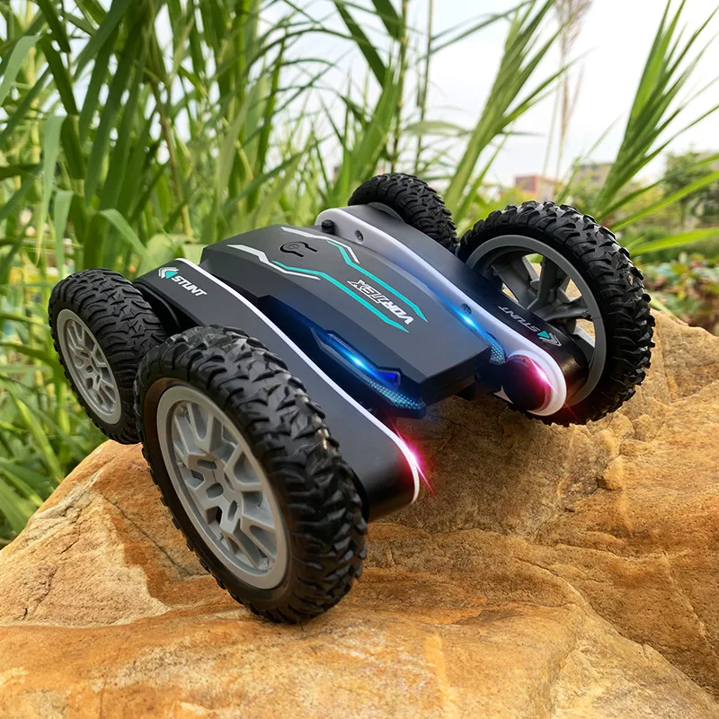 Factory wholesale  kids new mountain beach road rc car with lighting electric rc twist fancy stunt rolling remote car toy