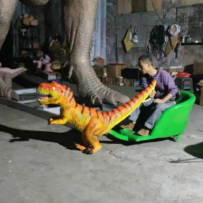 amusement park attraction kids dinosaur ride