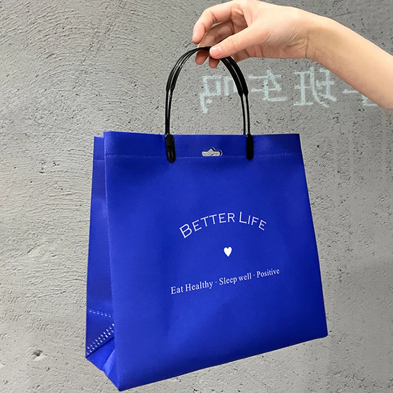 Wholesale environmentally-friendly degradable non-woven handbag free design LOGO gift shopping packaging clothes bag.