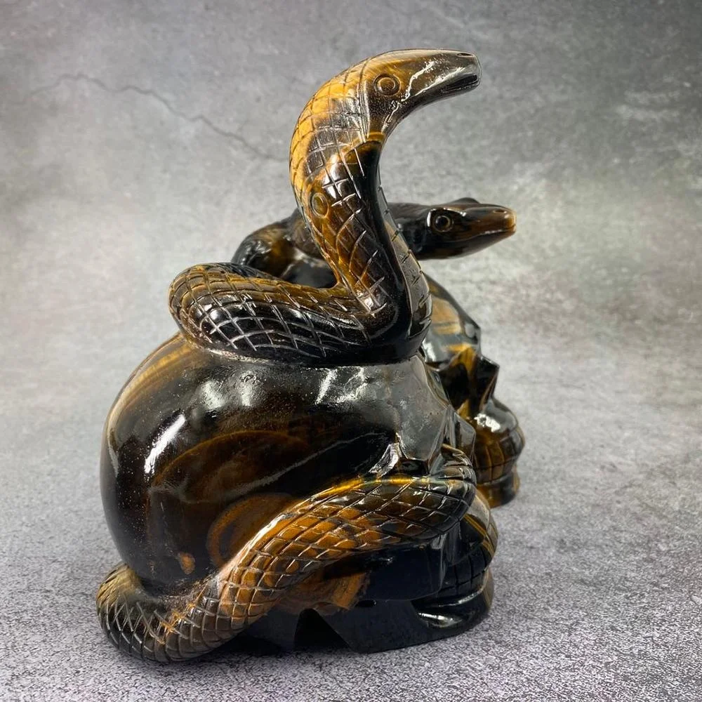 Customized product hand carved crystal skull with snake art sculpture folk crafts tiger eye skull for decoration
